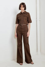 Women’s brown twill pants with high-rise wide legs and button front, fitted through hips.