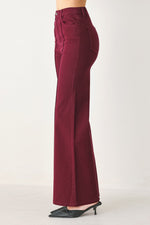 Women’s burgundy twill pants, high-rise straight wide leg with side pocket detail.
