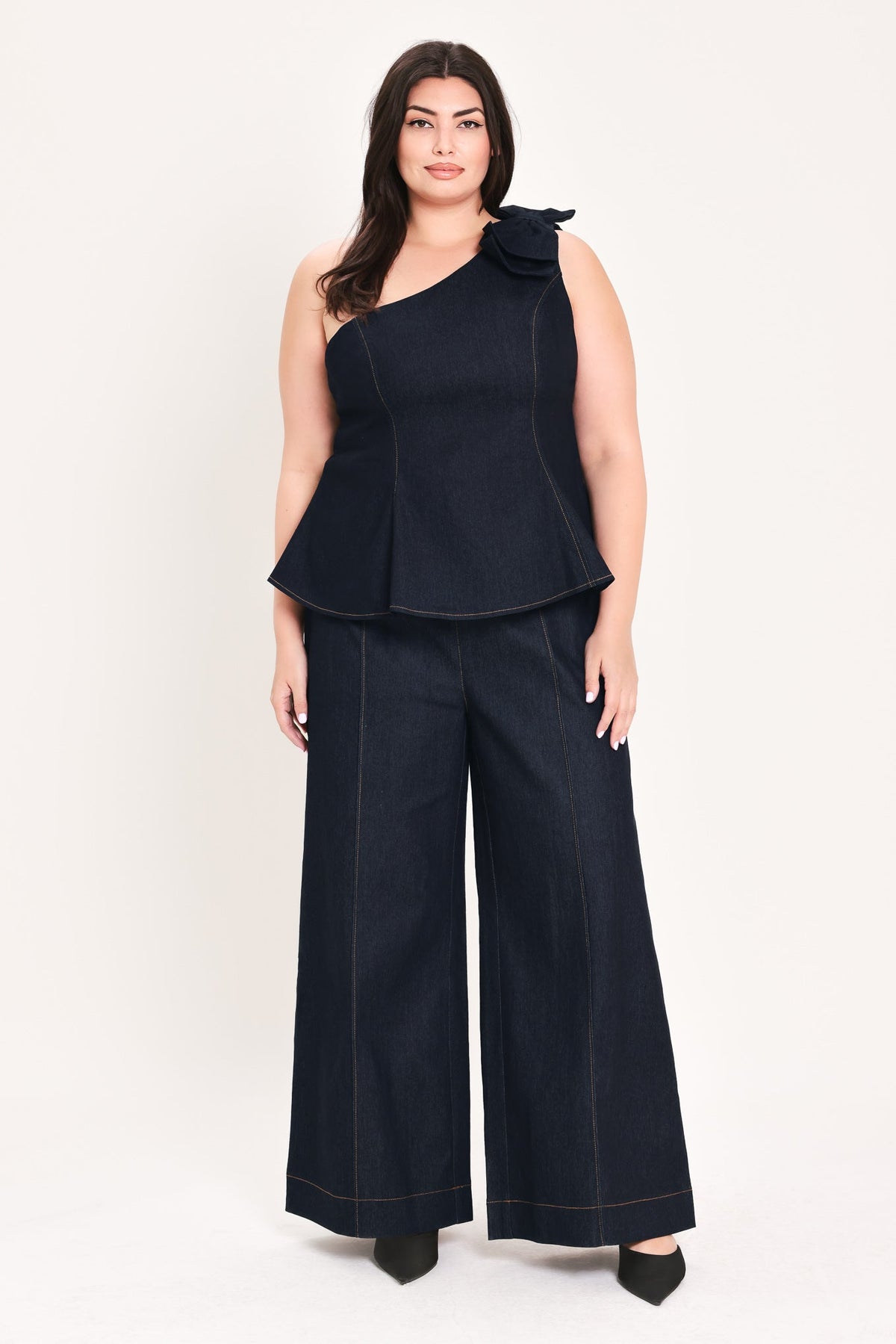 Dark denim wide-leg pants with button belt and contrast orange stitching
