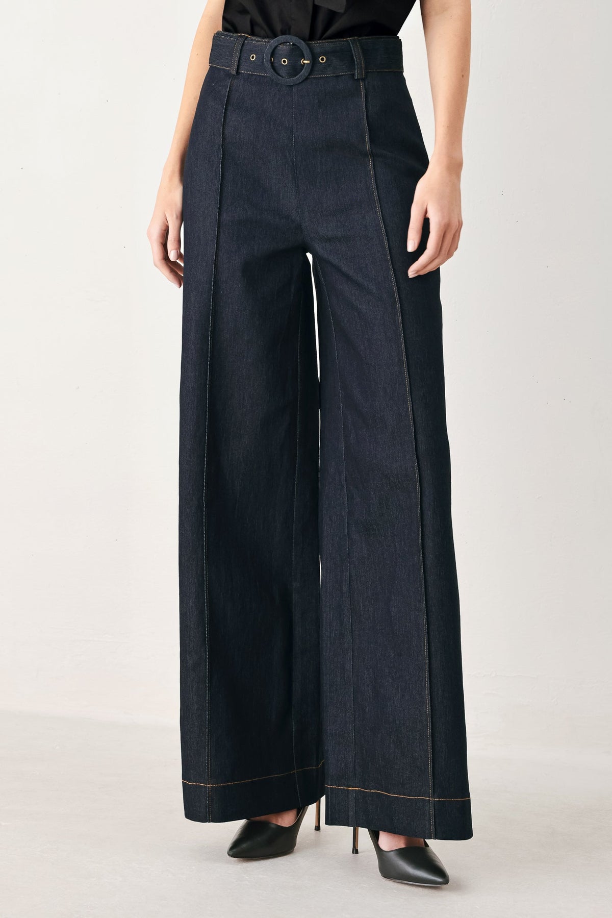 Dark denim wide-leg pants with buckle belt and contrast edge stitching