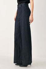 Dark denim wide-leg pants with back yoke, center seam, and contrast hem stitching