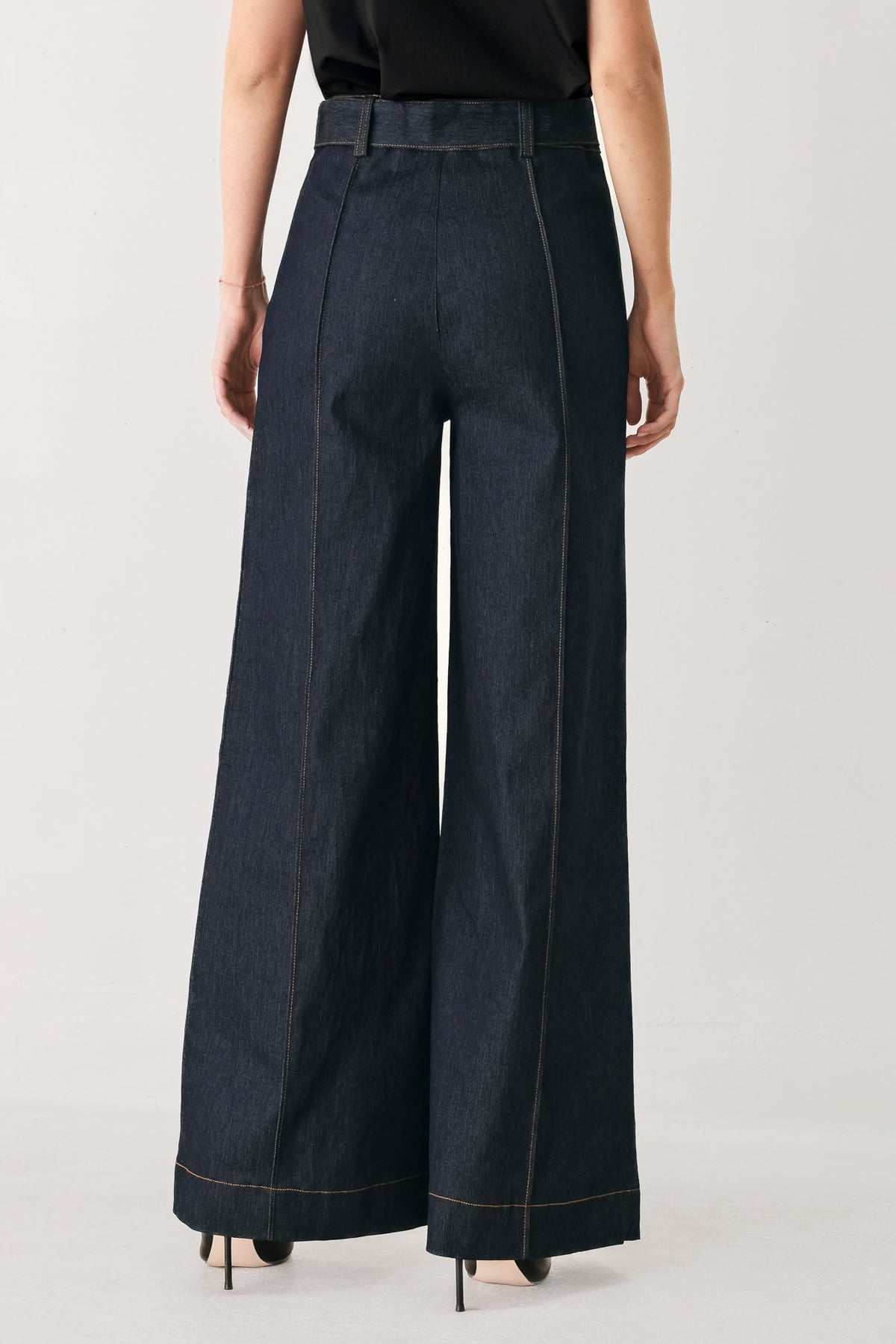 Dark denim wide-leg pants with center back seam and contrast stitch trim