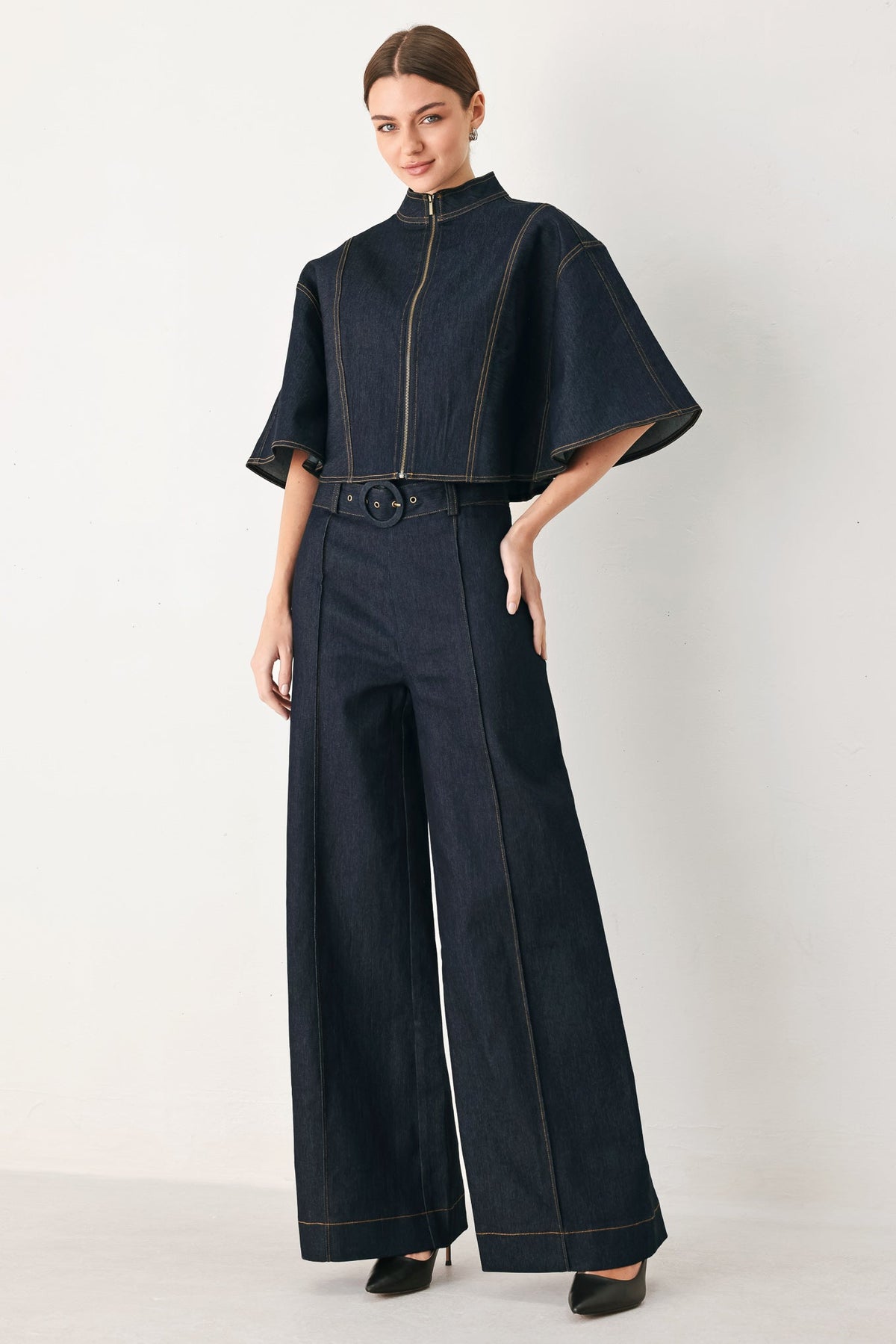 Dark denim wide-leg pants with high waist belt and contrast panel seam lines