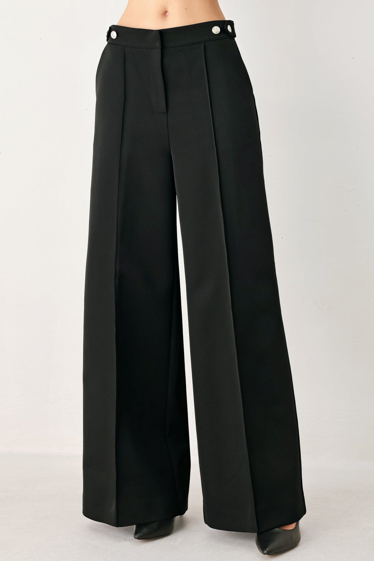 Black high-waisted woven palazzo pants with button-tab waistband and wide legs