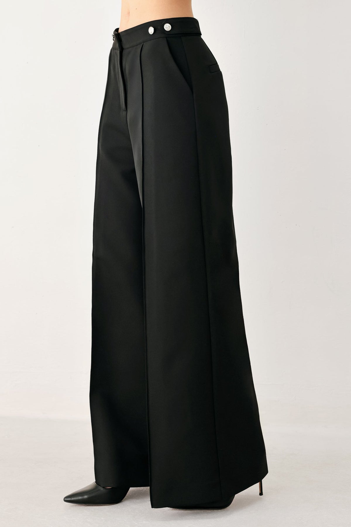 Black high-waisted wide-leg palazzo pants with structured drape and belt loops