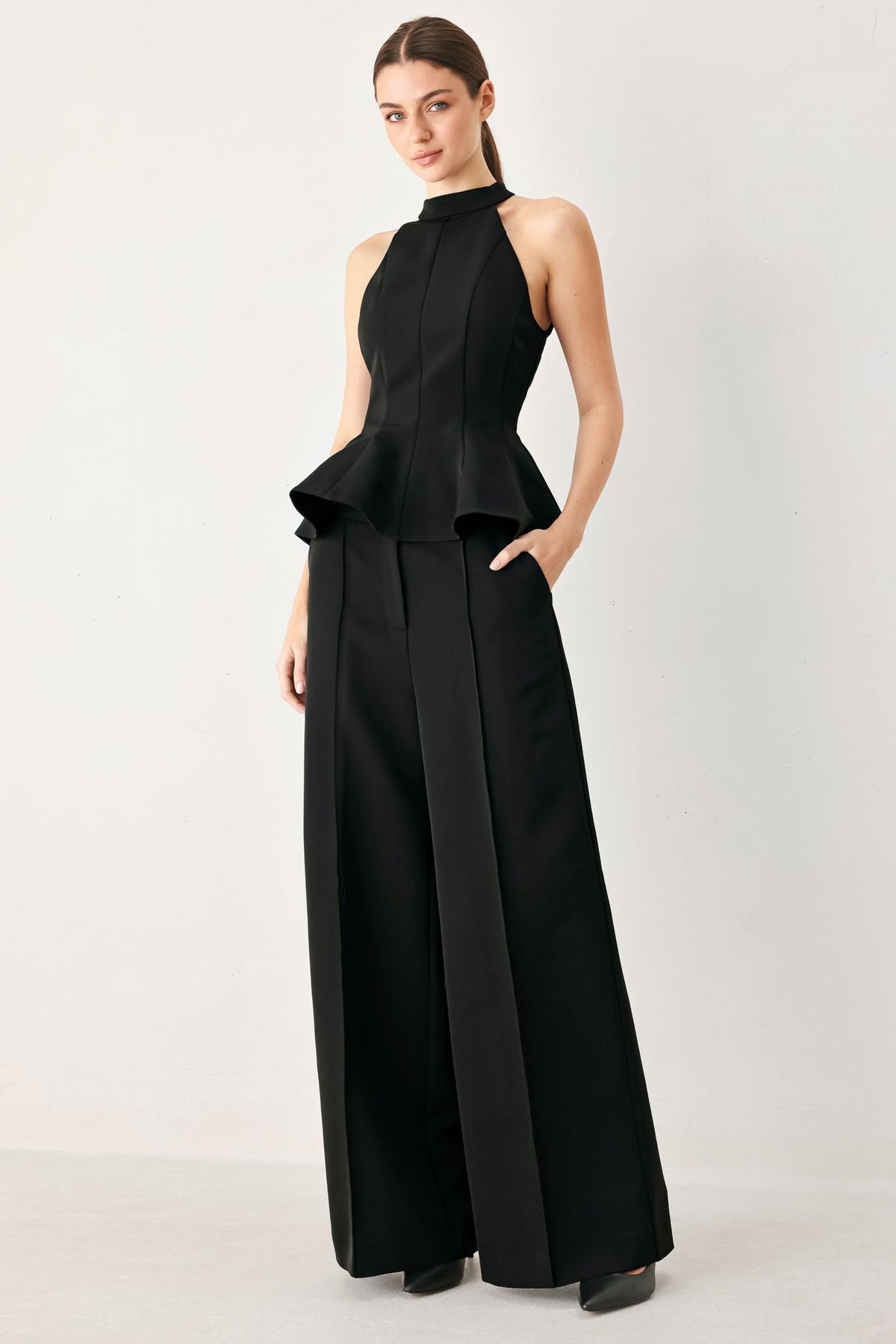 Black high-waisted palazzo pants with pleated front and wide flared legs