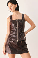 Brown embossed faux leather skort with front zipper and buckled pocket accents