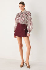 Burgundy woven skort with button front and A-line skirt overlay