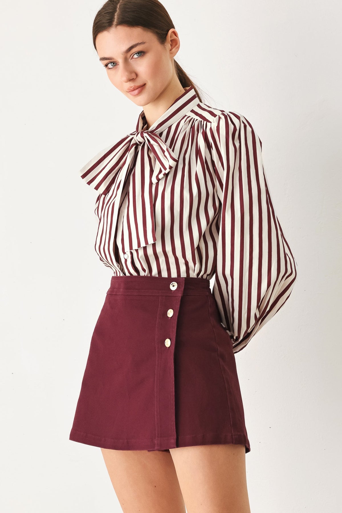 Burgundy woven skort with three-button front and structured waistband