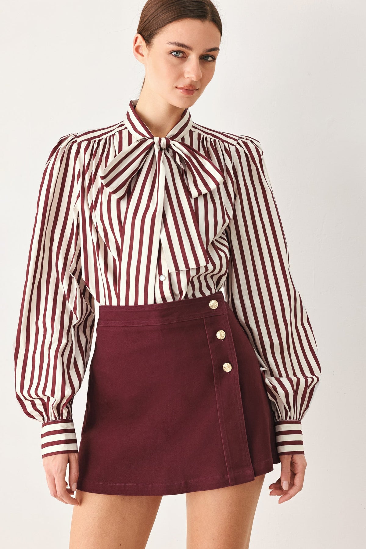 Burgundy woven skort with front button placket and side pockets
