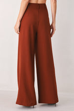 Rust woven wide-leg pants with center back seam and long flowy legs