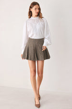 Brown tweed check skort with pleated front and flared mini length