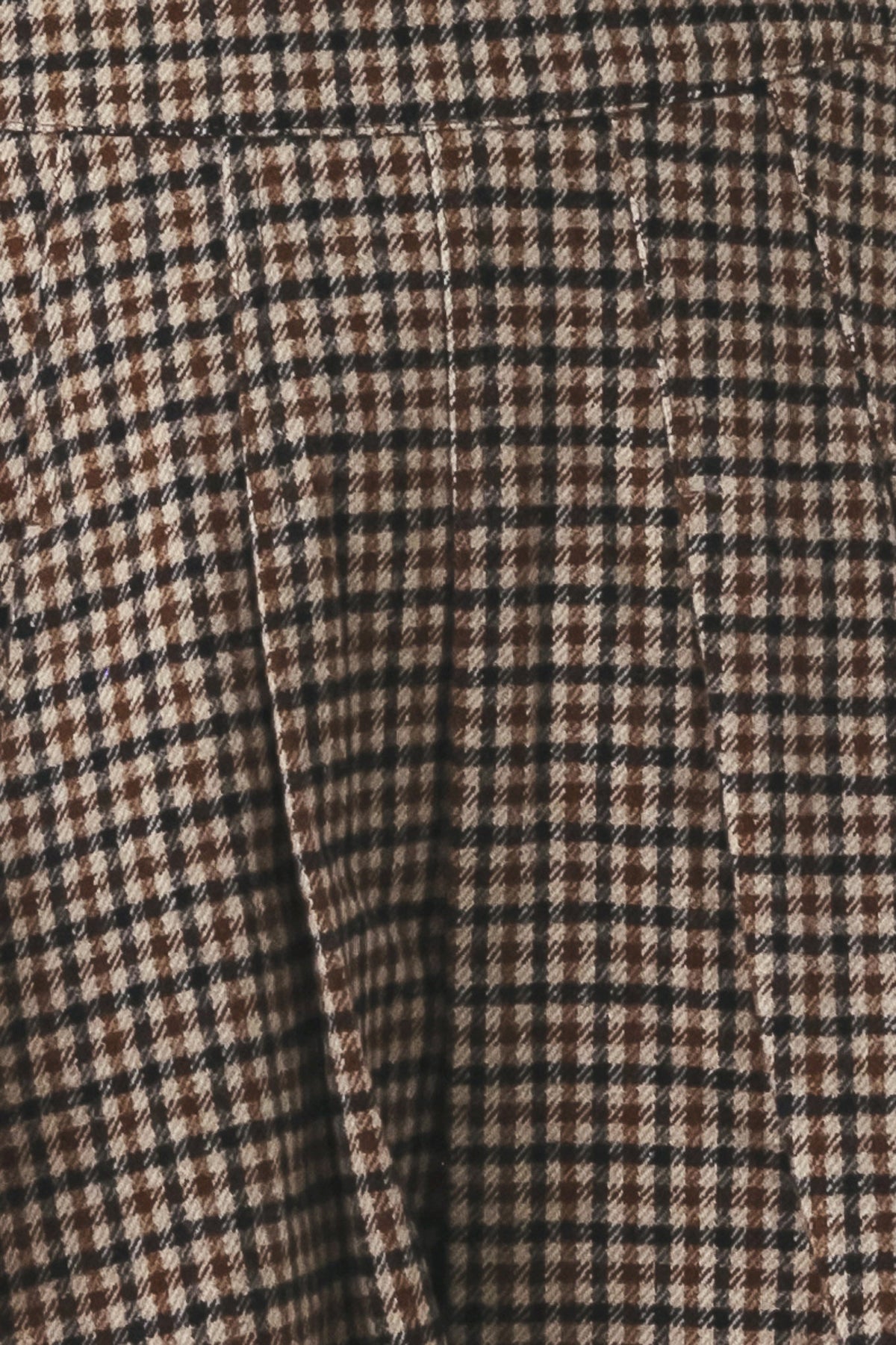 Tweed fabric texture in brown and black with fine check pattern weave