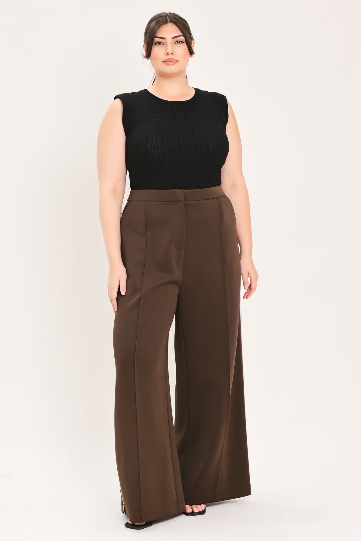 Brown wide-leg stretch woven pants with pleated front and long relaxed legs