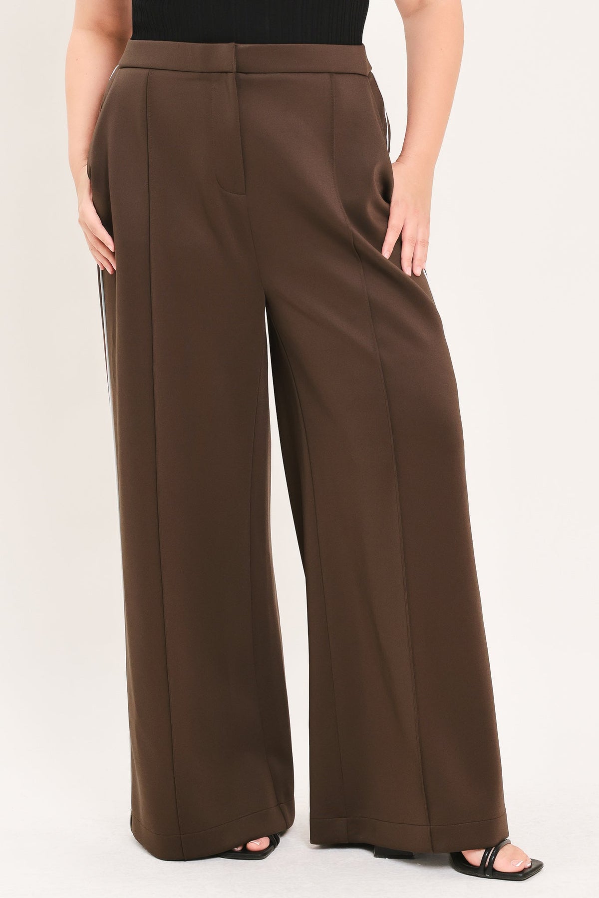 Brown high-rise wide-leg stretch pants with vertical side stripe detail