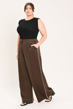 Brown wide-leg stretch pants with front crease and contrast stripe down leg