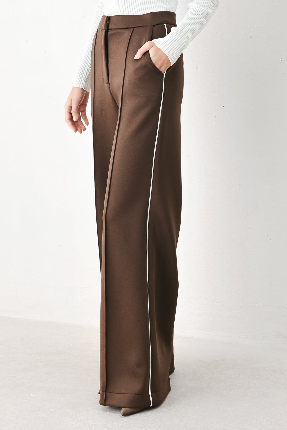 Brown wide-leg woven pants with pintuck front and white vertical side stripe