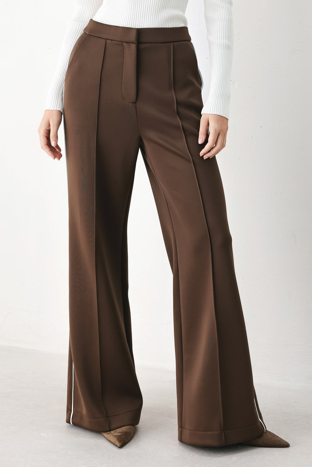 Brown wide-leg stretch woven pants with front pleat and elastic waistband