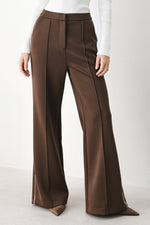 Brown wide-leg stretch woven pants with front pleat and elastic waistband