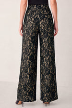 Black and camel lace wide-leg pants from behind, slim waistband and wide legs