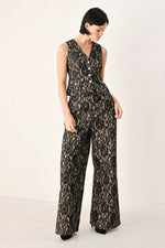 Sleeveless styling look: black and camel lace wide-leg pants with wide flared hems