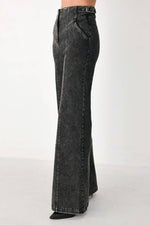 Black denim wide-leg pants with front fly detail and straight long legs