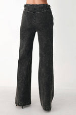 Black denim wide-leg pants with high-rise waist and wide straight leg