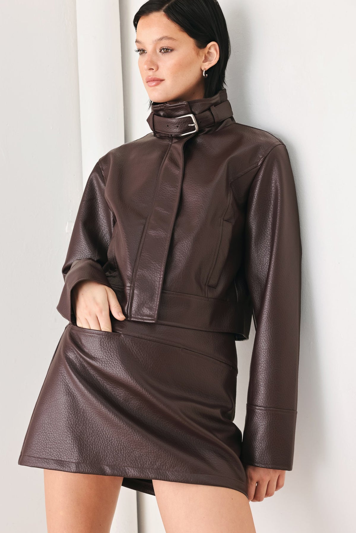 Brown faux leather skort with draped front panel and angled waistband detail