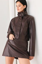 Brown faux leather skort with draped front panel and angled waistband detail