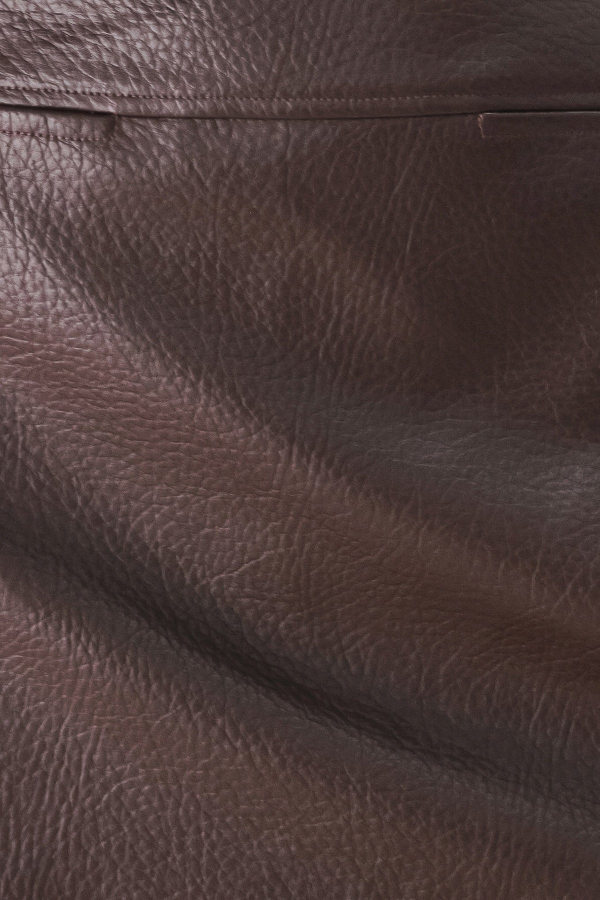 Brown faux leather texture detail with pebbled grain pattern