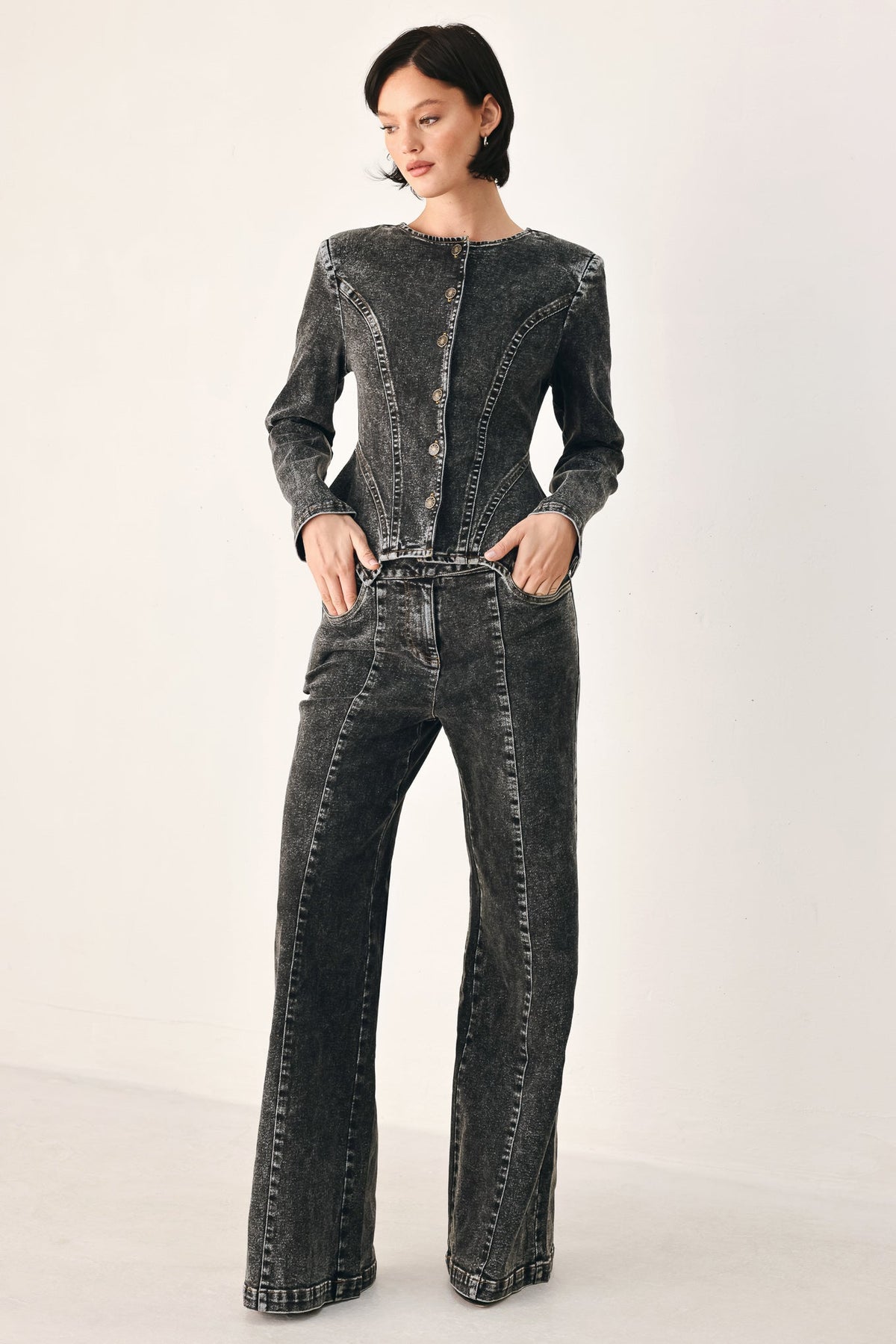 Black washed denim crossover jeans with wide legs and front closure