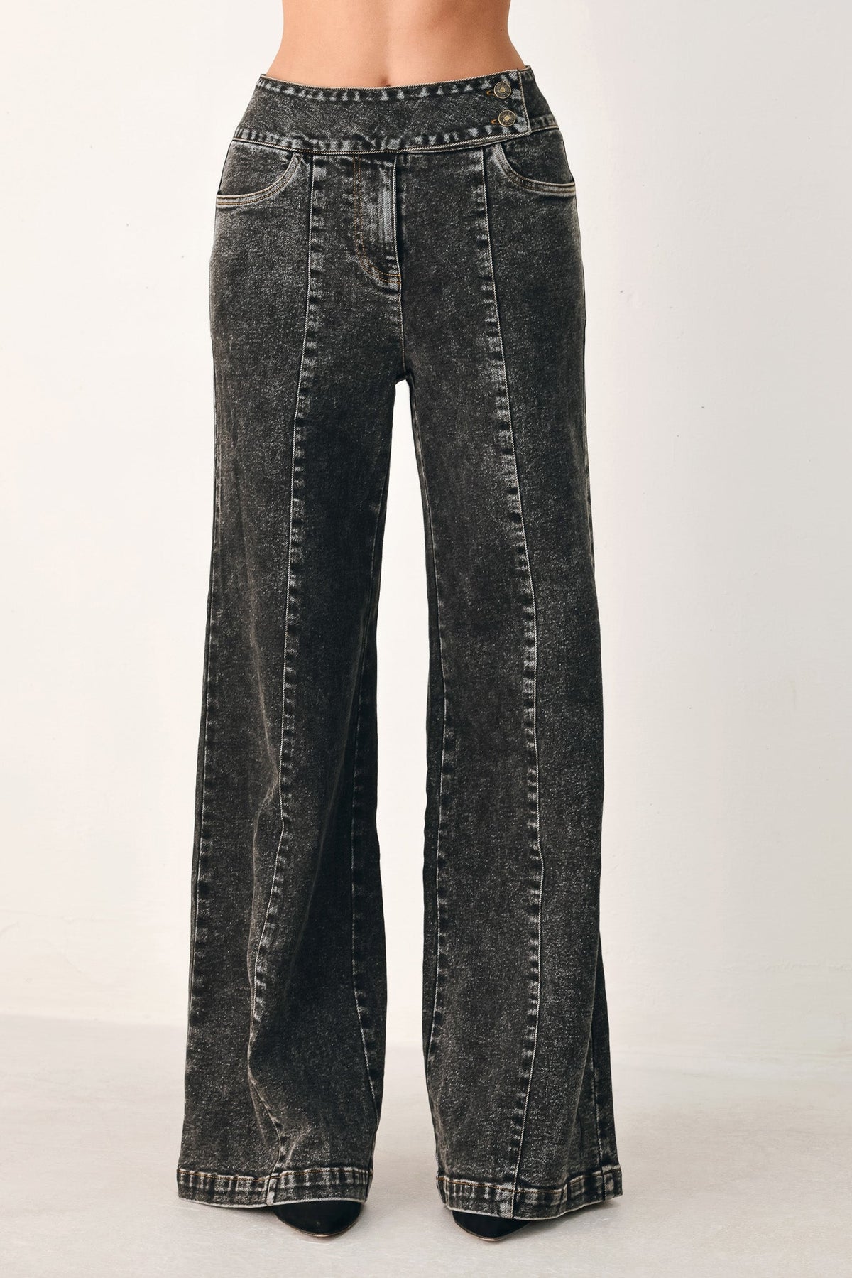 Black washed denim crossover pants with wide legs and front patch pockets