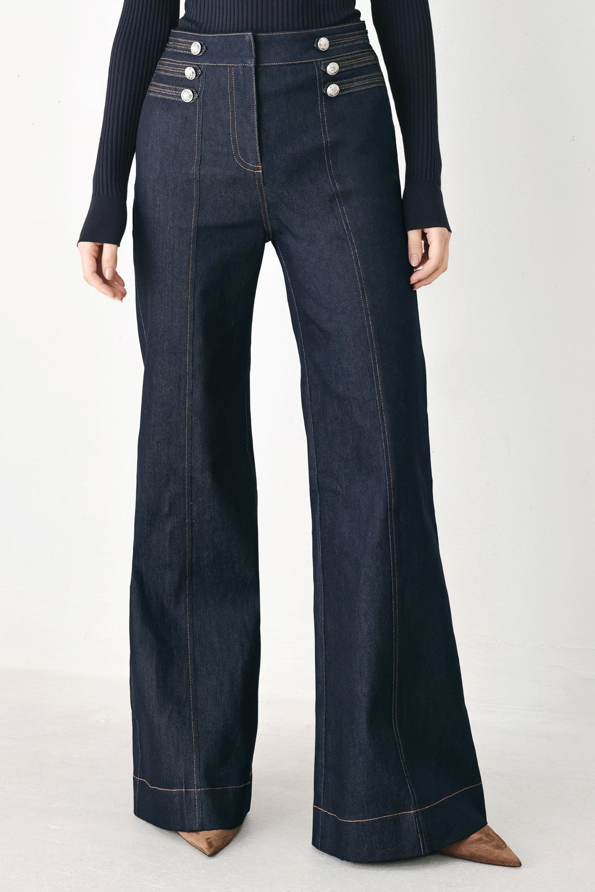 Dark indigo flare jeans with button-detail front pockets and contrast stitching