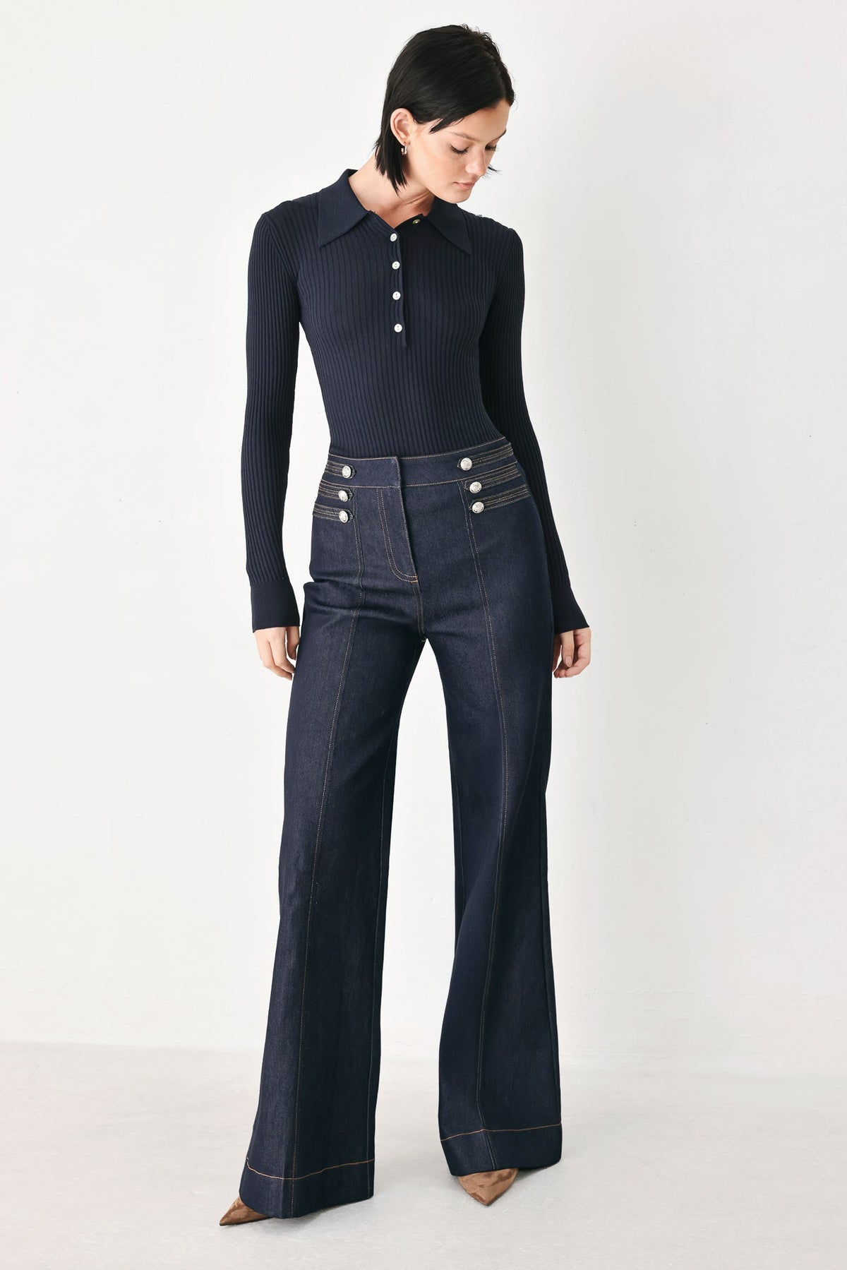 Dark indigo flare jeans with five-button front and contrast topstitching
