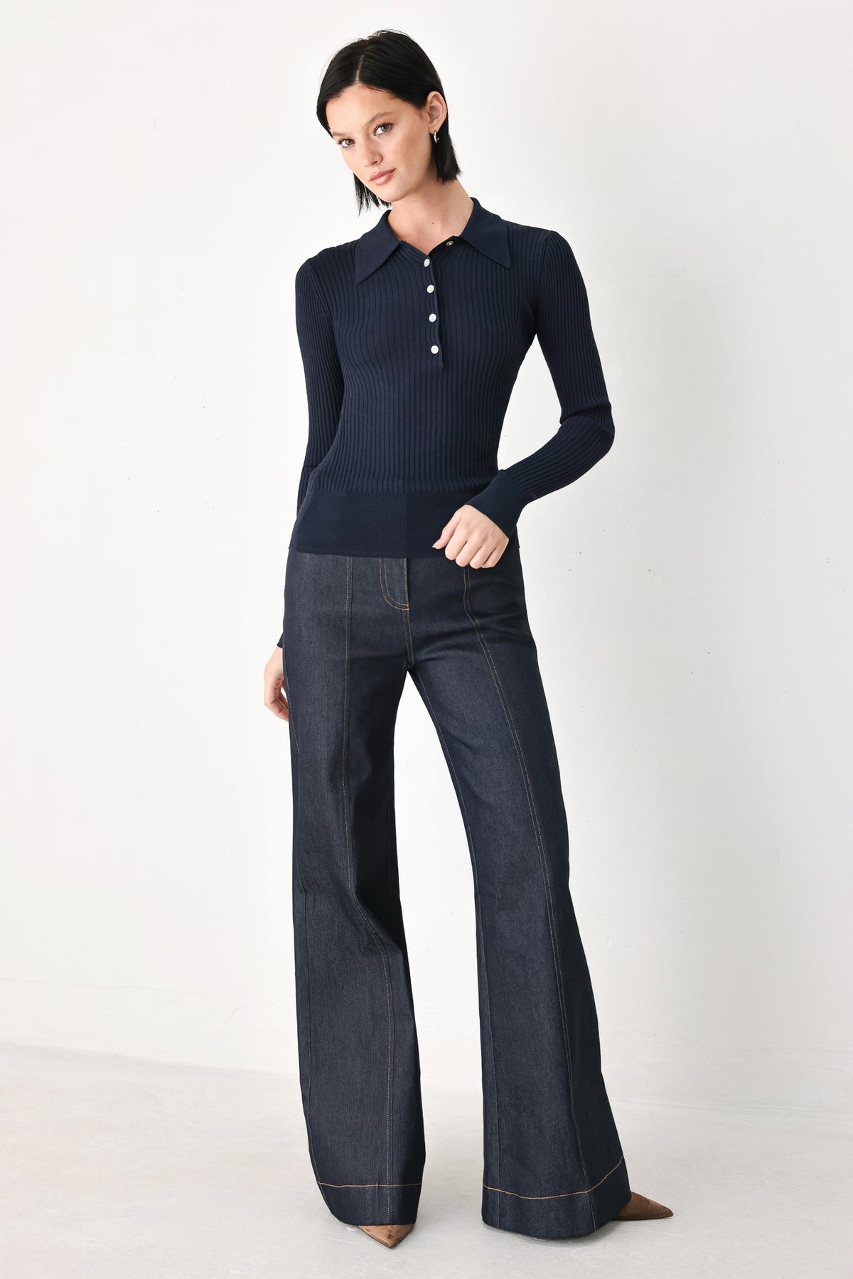 Navy long-sleeve ribbed polo top with small button placket