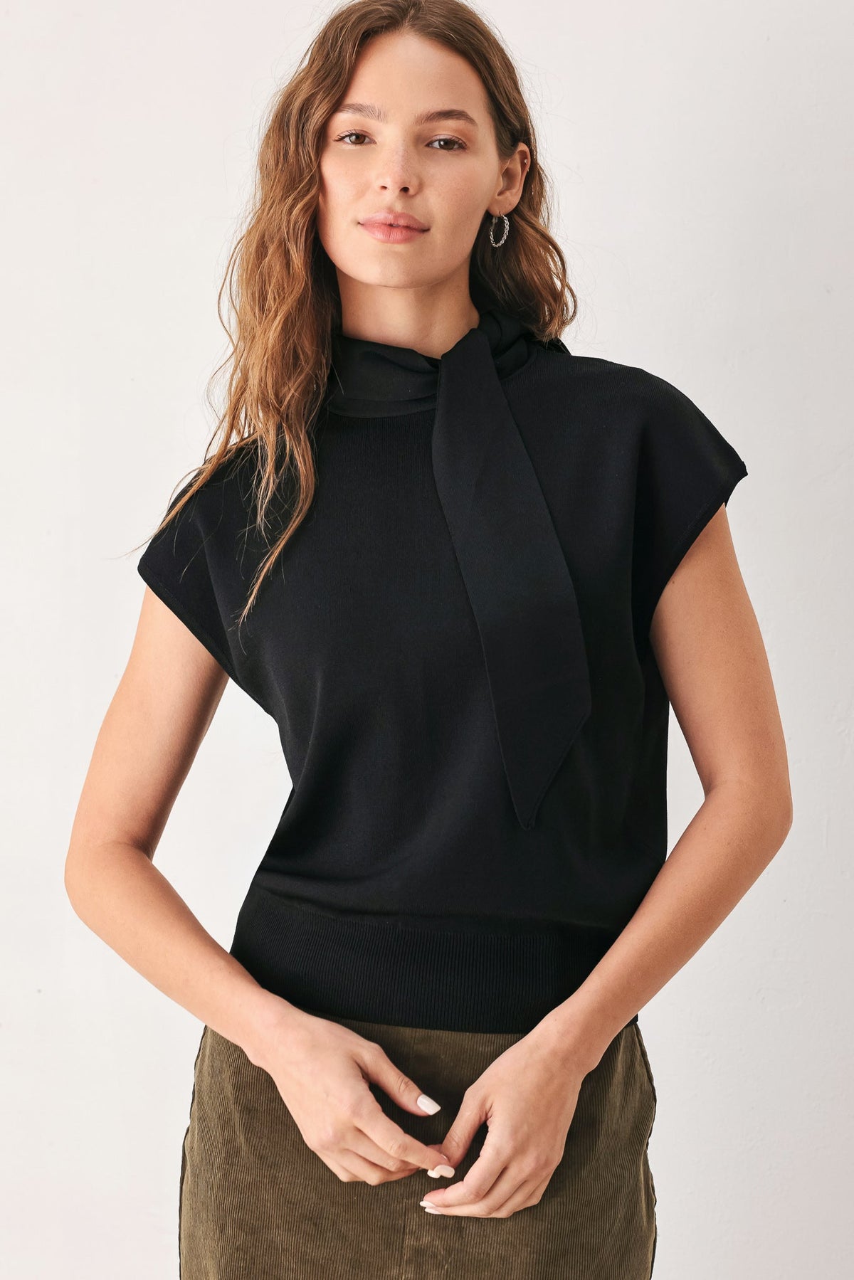 Black soft knit top with scarf-style neck tie and short cap sleeves