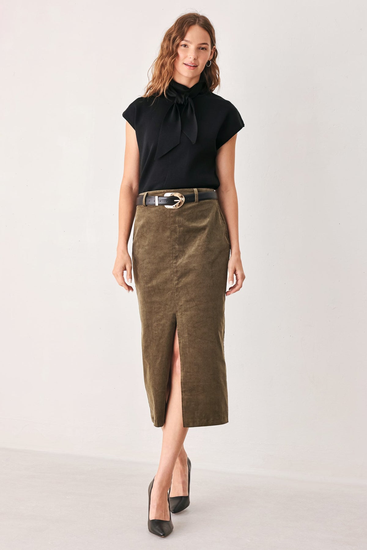 Black soft knit top with scarf-style neck bow and short sleeves