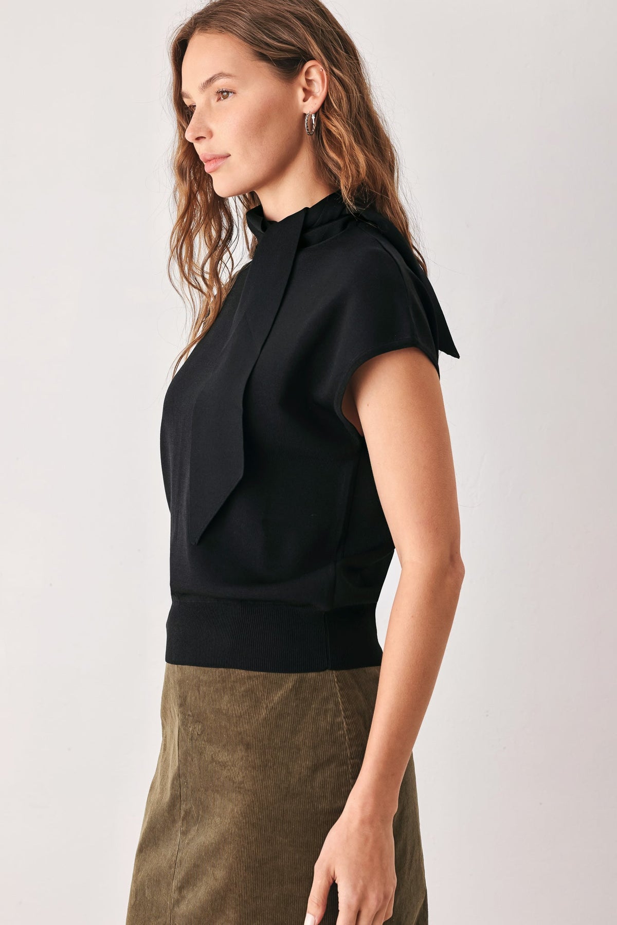 Black soft knit top with scarf-style neck tie and relaxed short sleeves