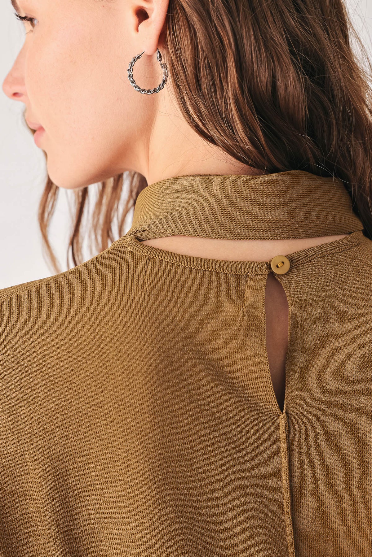 Soft knit scarf sweater top in dark olive with snap button at back neck