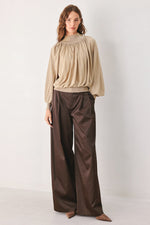 Taupe draped knit sweater top with gathered high neck and long puff sleeves