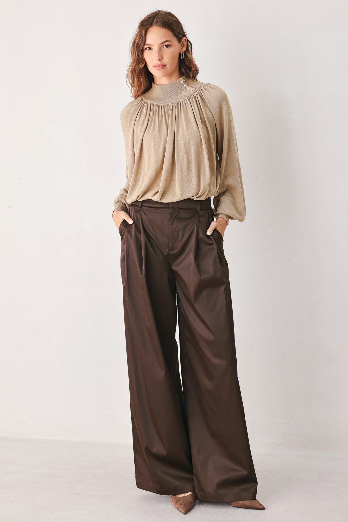 Taupe draped knit sweater top with long sleeves and relaxed gathered bodice