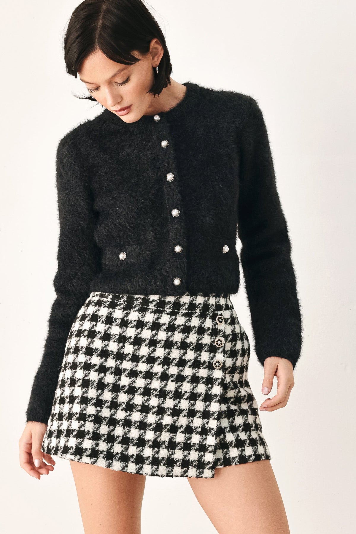 Black fuzzy cropped cardigan with button-front and metal-look buttons