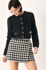 Black fuzzy cropped cardigan with button-front and metal-look buttons