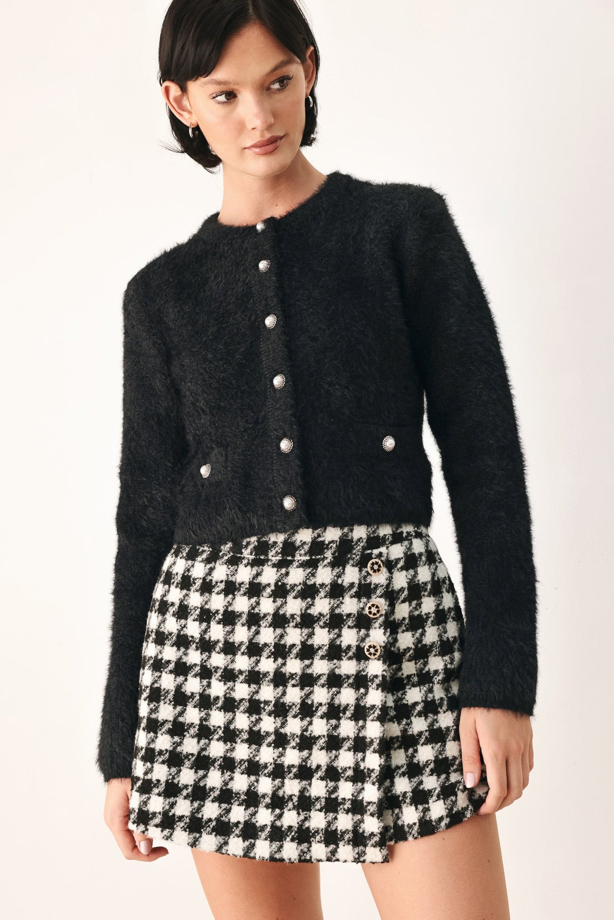 Black fuzzy cropped cardigan with button-front and round neckline