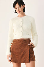 Ivory fuzzy cropped cardigan with button-front and long sleeves