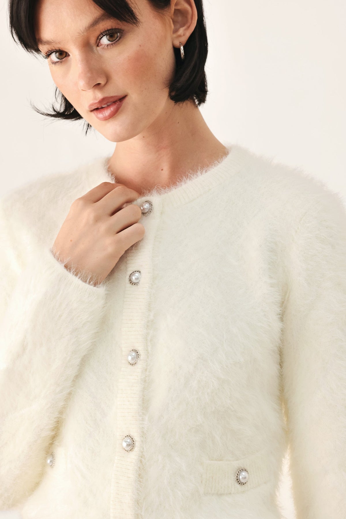 Ivory fuzzy cropped cardigan with button-front and round neckline