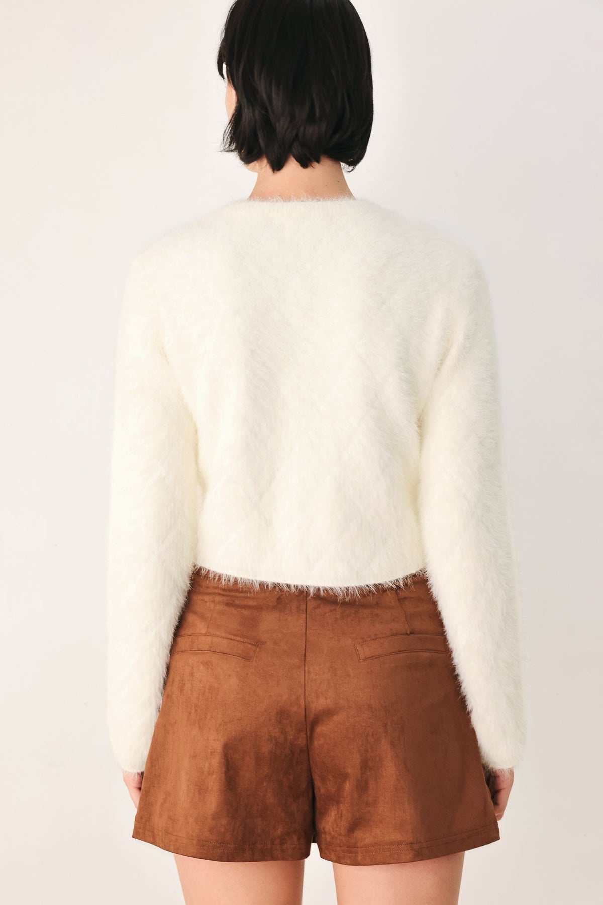 Ivory cropped cardigan, back view, long sleeves