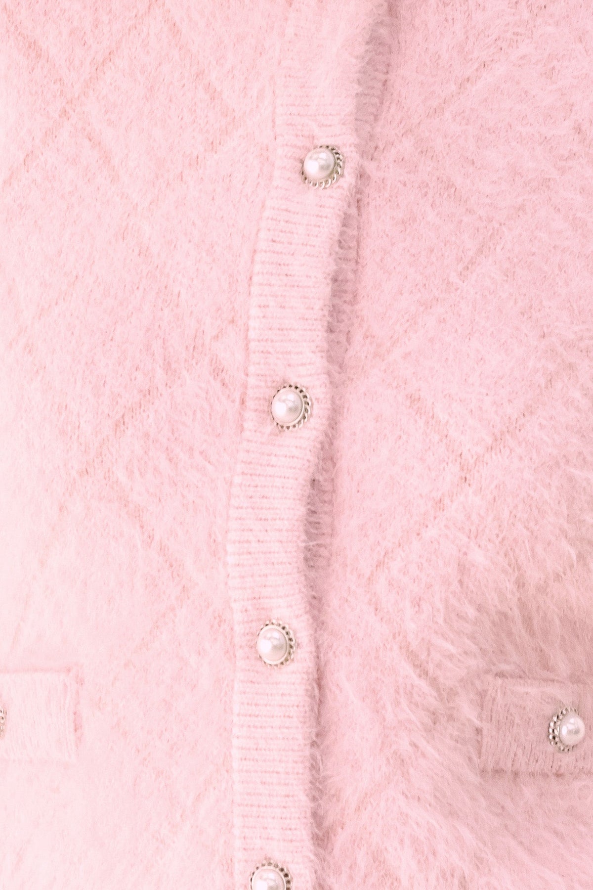Pink cropped cardigan with three button closures on front placket