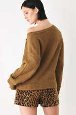 Camel-brown one-shoulder cinched neck sweater with clasp at neckline