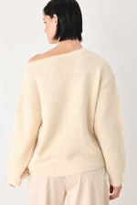 Ivory knit sweater with cinched back neckline and long sleeves